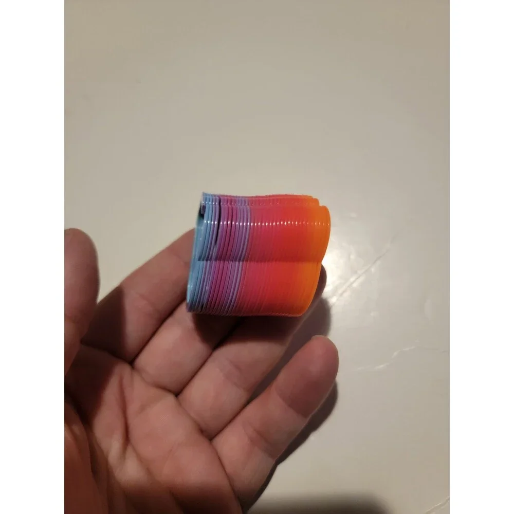 Mini Slinky Style Toy Rainbow Multi Color Spring Coil Foot Shape?